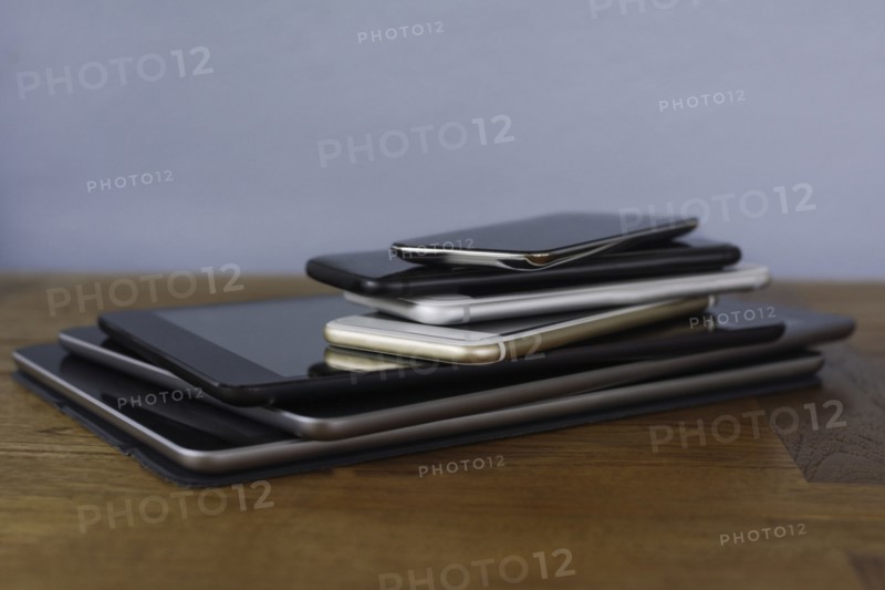 Stack of smart phones and digital tablets