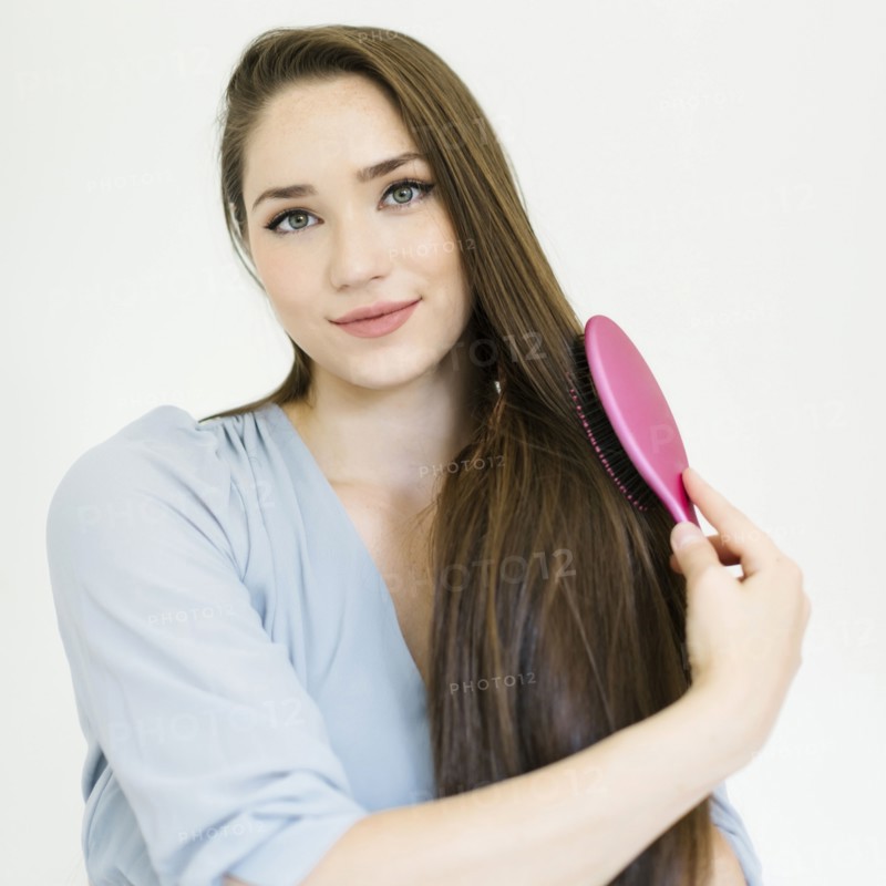 Woman brushing her hair