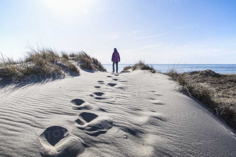 Woman walking on sand