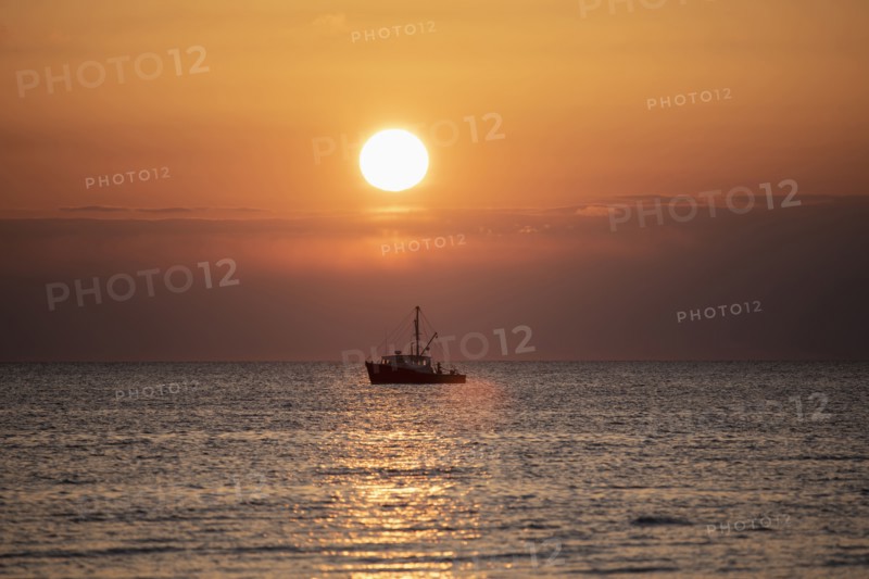 Fishing boat at sunset