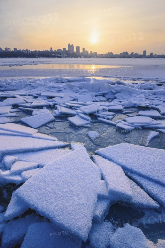 Ice on river at sunset