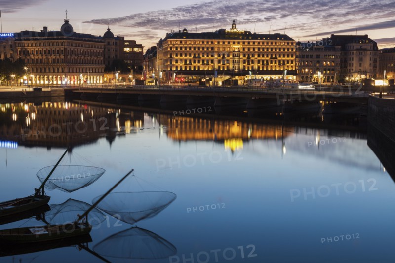 Buildings by river at sunset in Stockholm, Sweden