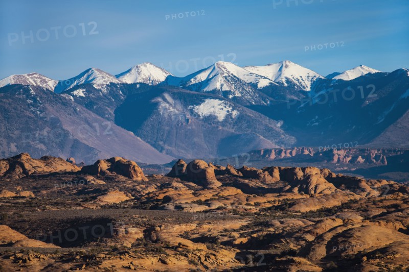 Snowcapped La Sal Mountains and sand dunes in Arches National Park, Utah, USA