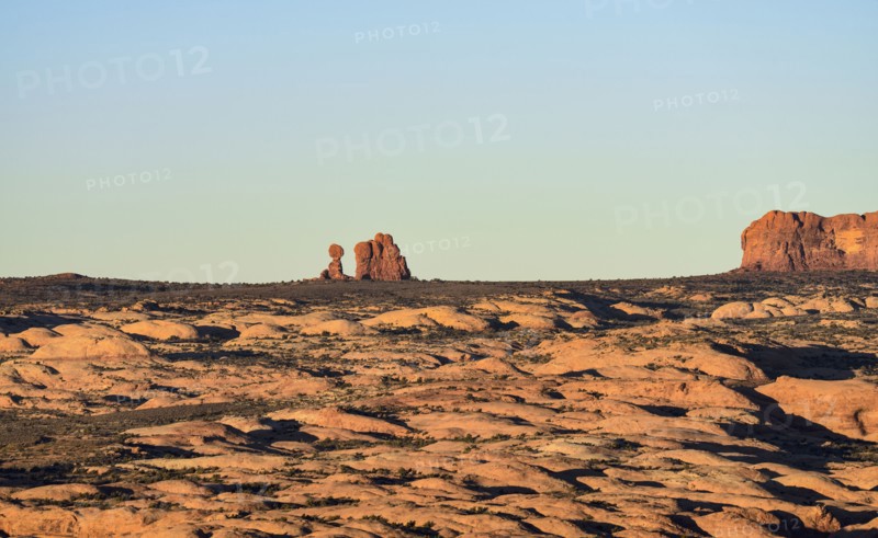 Sand dunes and Balanced Rock in Arches National Park, Utah, USA