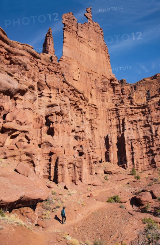 Woman hiking by Fishers Tower in Moab, Utah, USA