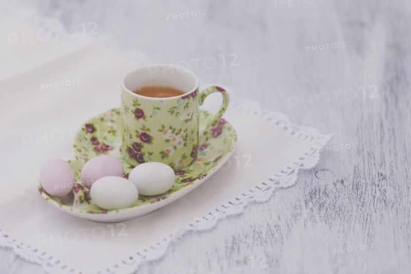 Eggs on floral plate with matching cup of tea