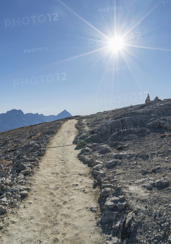 Sun over path in the Dolomites, South Tyrol, Italy