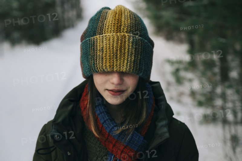 Teenage girl with colorful woollen hat during winter