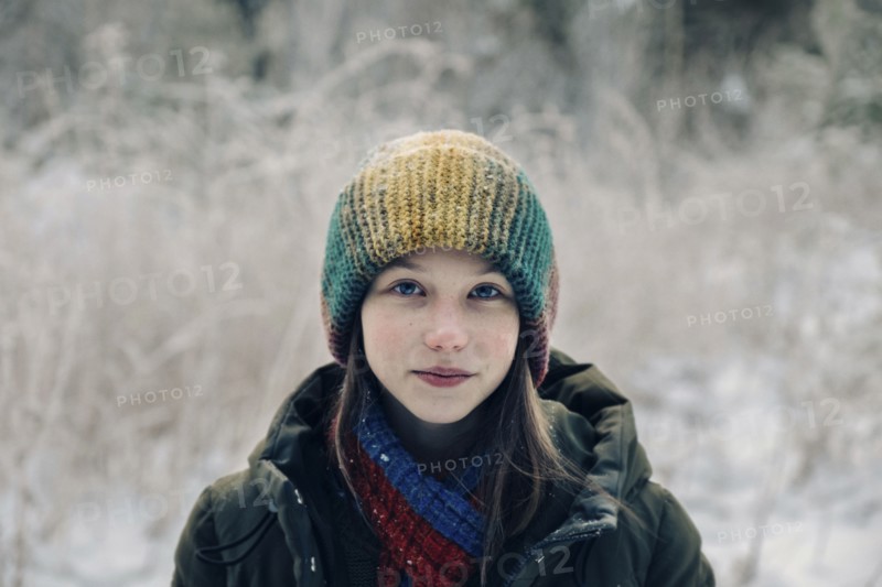 Teenage girl with colorful woollen hat during winter