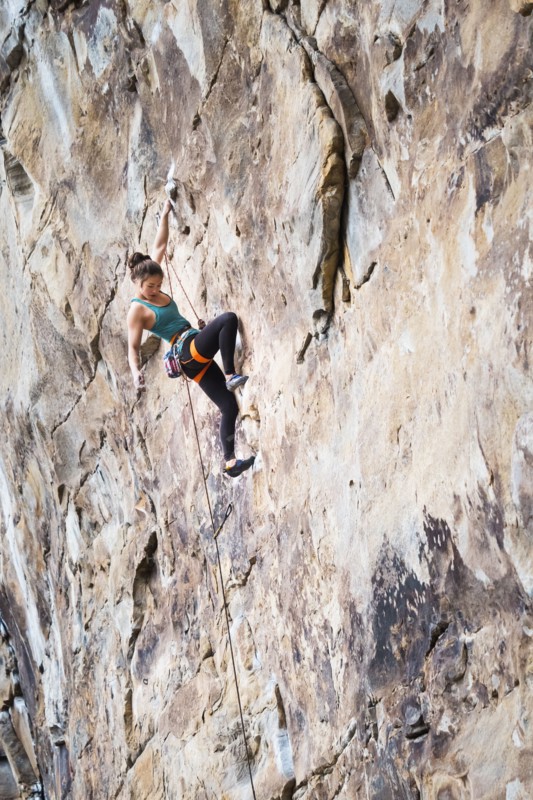 Teenage girl rock climbing