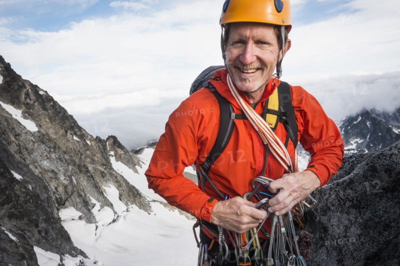 Mature man mountain climbing on Mount Stuart in North Cascade Mountains, Washington, USA