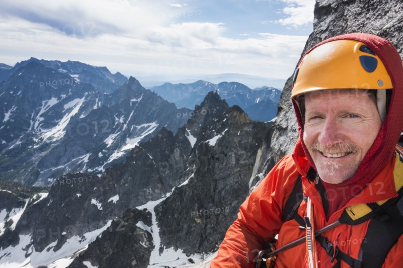 Mature man mountain climbing on Mount Stuart in North Cascade Mountains, Washington, USA