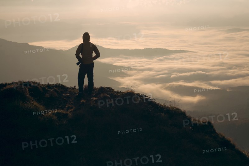 Silhouette of man in the Carpathian Mountain Range at sunrise