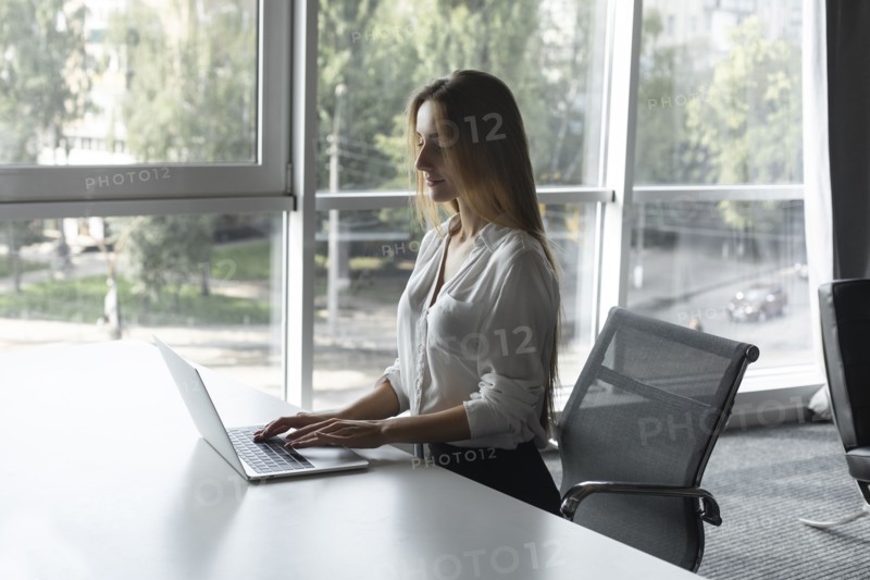 Young businesswoman working on laptop