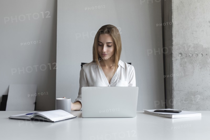 Young businesswoman working at desk