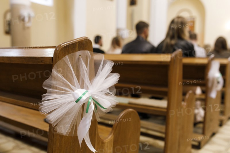 Tulle wedding decoration on pew