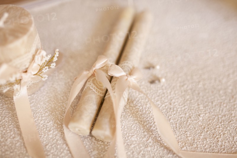 Candles tied by ribbon during wedding