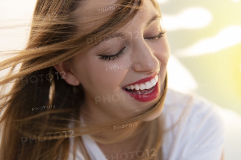 Portrait of windswept young woman wearing red lipstick