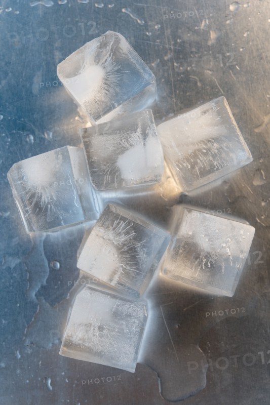 Ice cubes on silver surface
