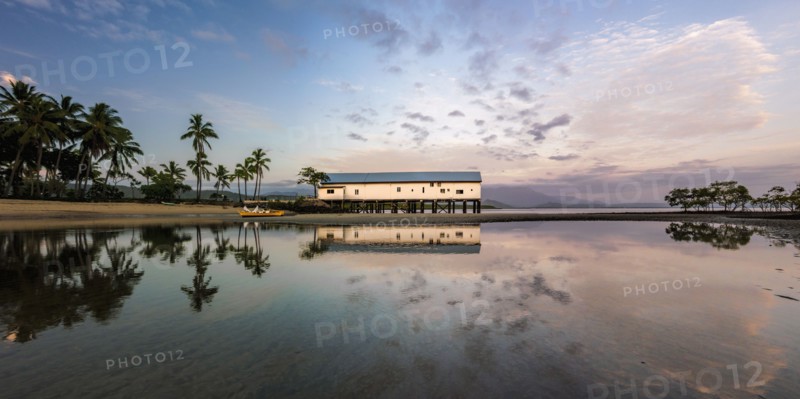 Building by beach at sunset in Port Douglas, Australia