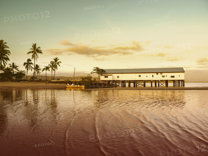 Building by beach at sunset in Port Douglas, Australia