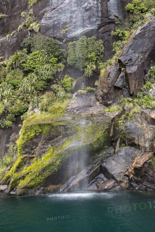 Waterfall in Milford Sound, New Zealand