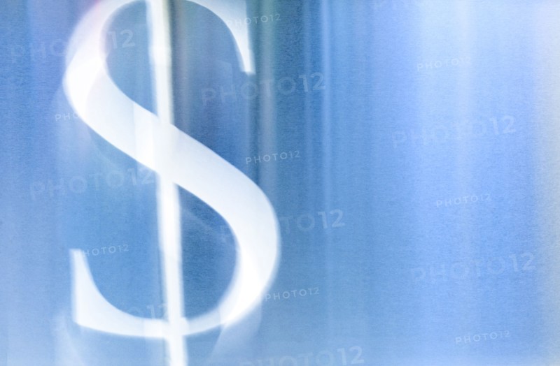 Illustration of white dollar sign against blue background
