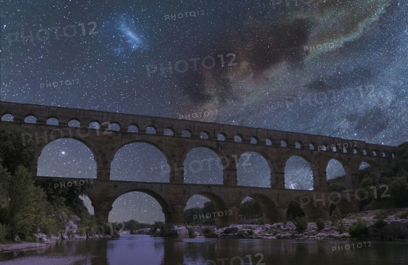 Pont du Gard under starscape at night in Vers-Pont-du-Gard, France