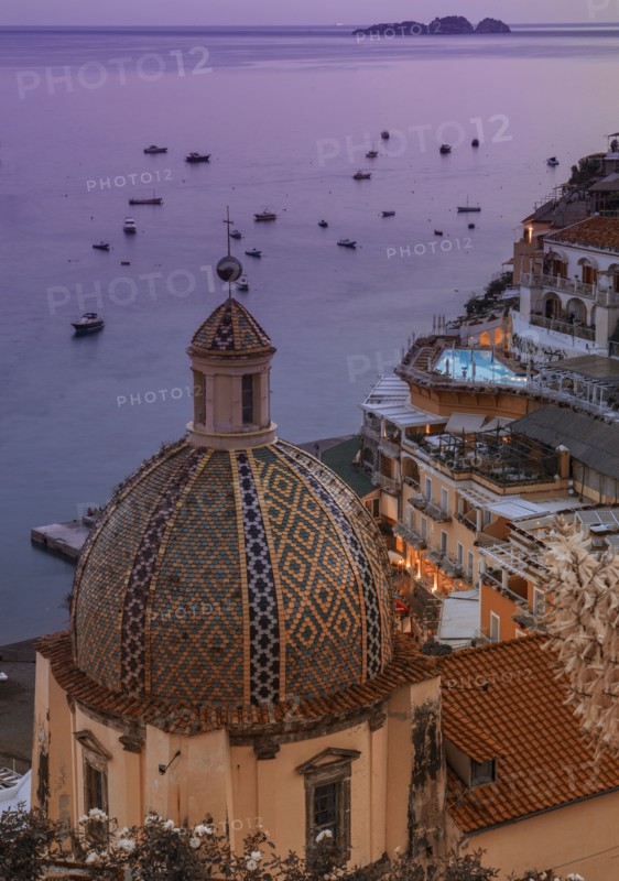 Patterned church dome at sunset in Positano on Amalfi Coast, Italy