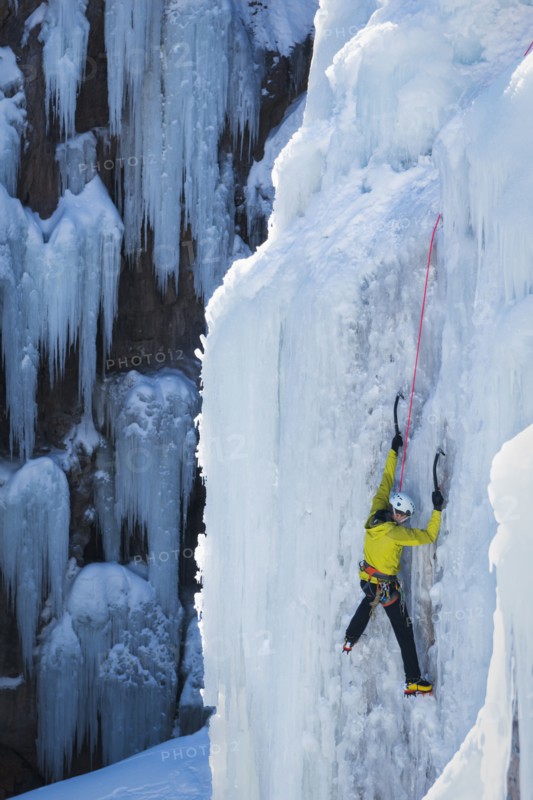 Man ice climbing in Ouray, USA