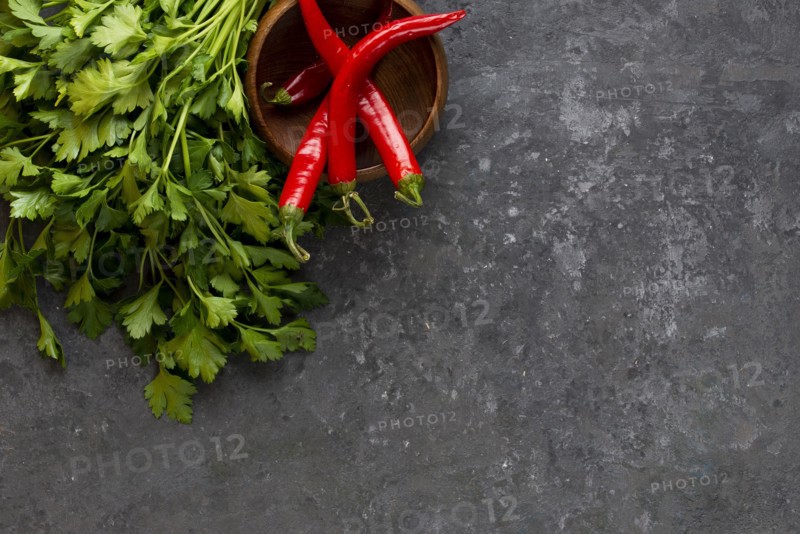 Parsley with chili peppers in bowl