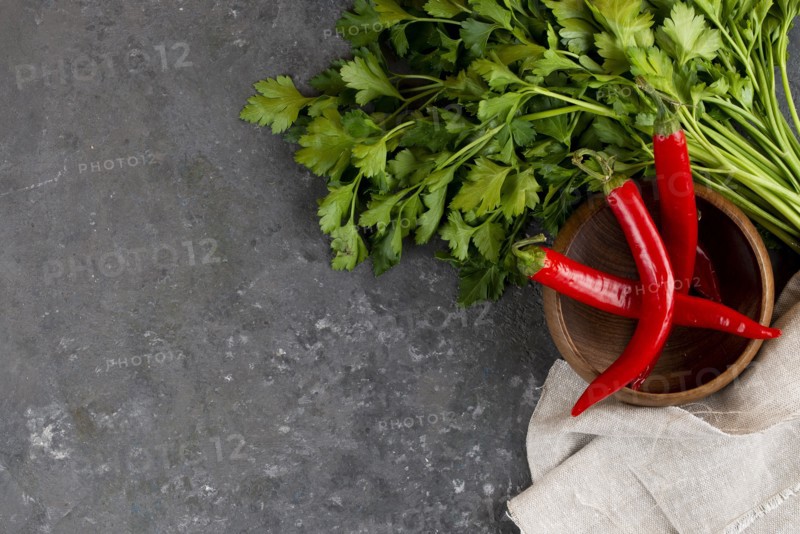 Parsley with chili peppers in bowl