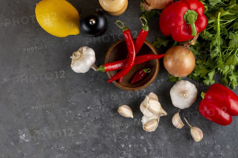 Raw vegetable ingredients with chili peppers