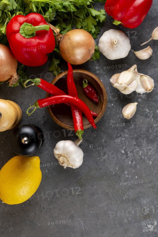 Raw vegetable ingredients with chili peppers