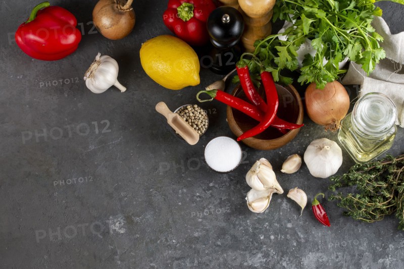 Raw vegetable ingredients with chili peppers