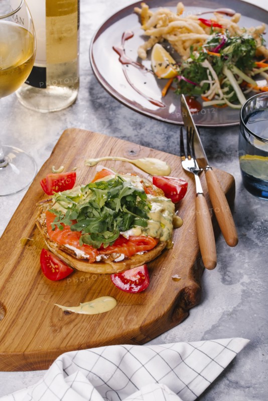 Salmon on bread with arugula