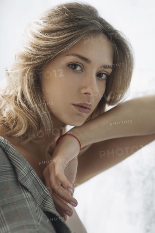 Portrait of young woman wearing natural make-up