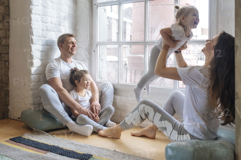 Family sitting by window