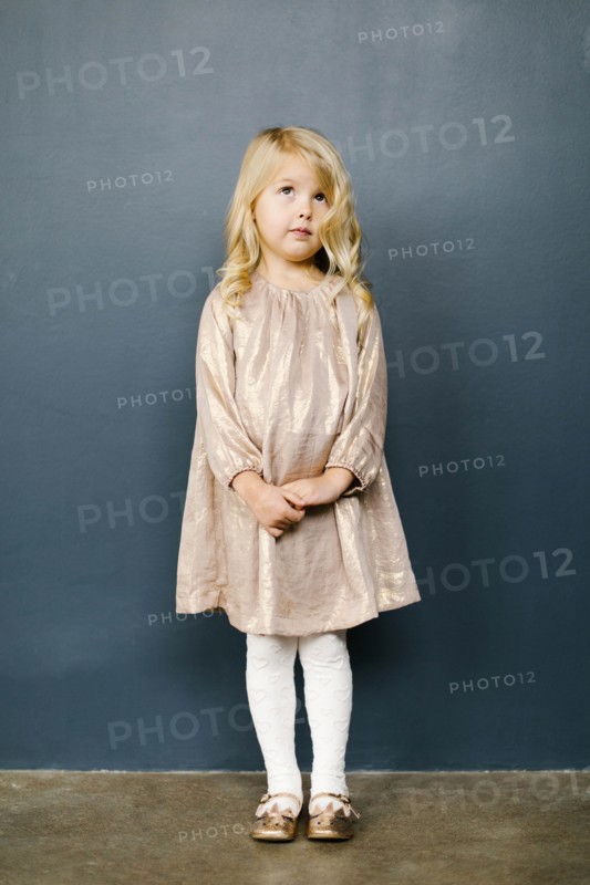 Girl wearing taupe dress
