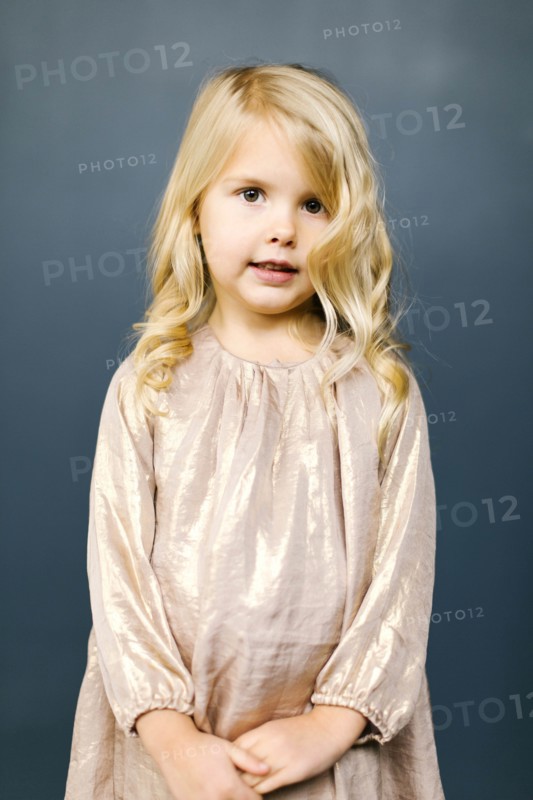 Girl wearing taupe dress
