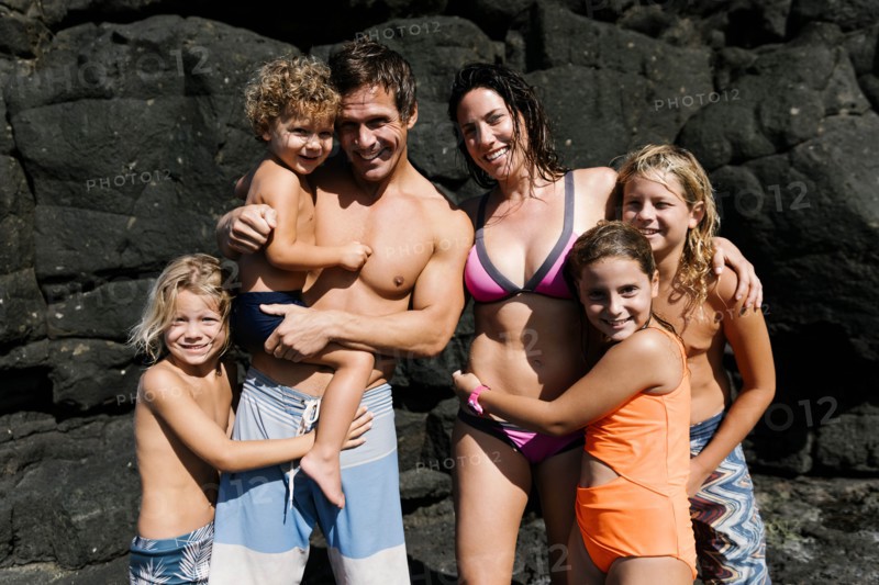 Family portrait on rocks at beach