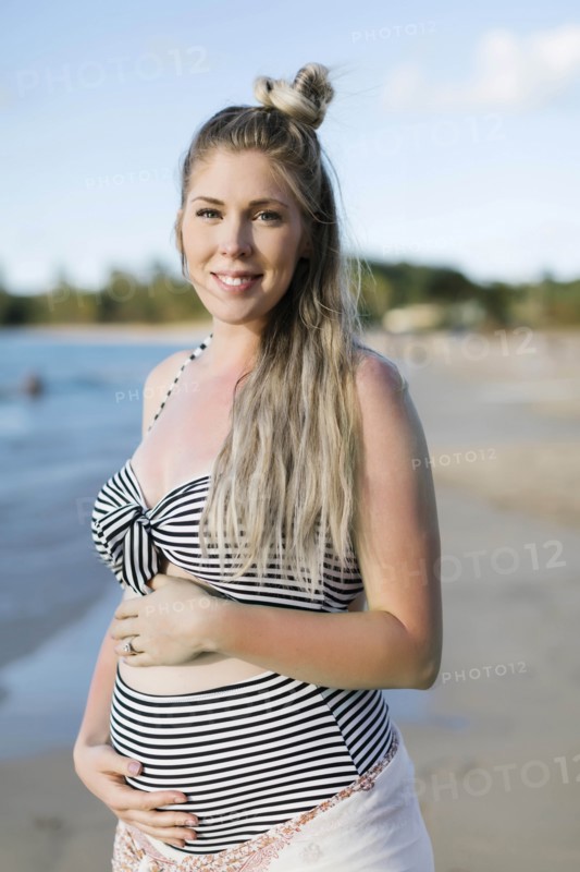 Pregnant woman on beach