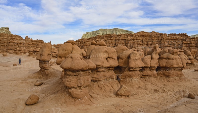 Woman hiking through Goblin Valley State Park in Utah, USA
