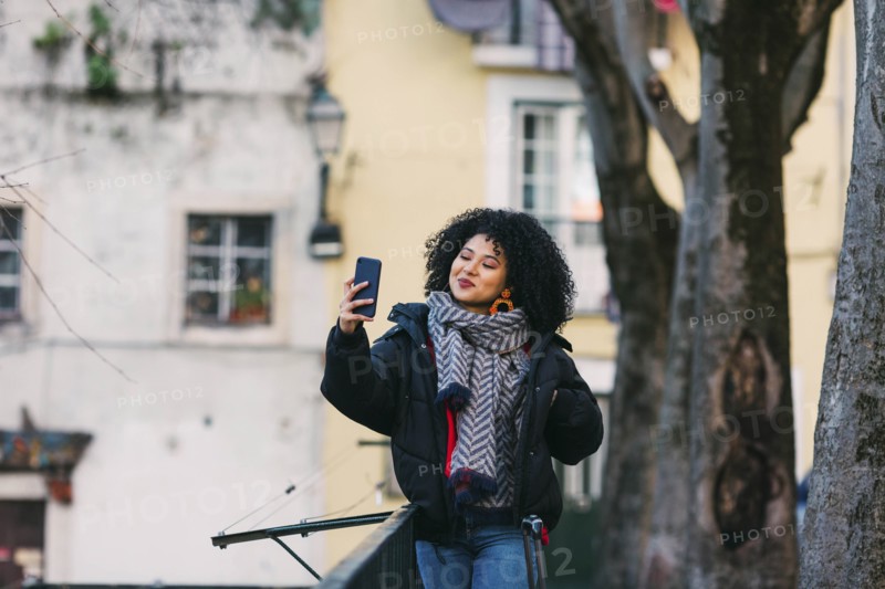 Young woman taking selfie in Lisbon, Portugal