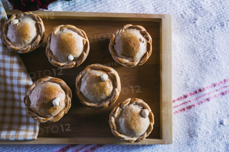 Chicken pies on wooden tray