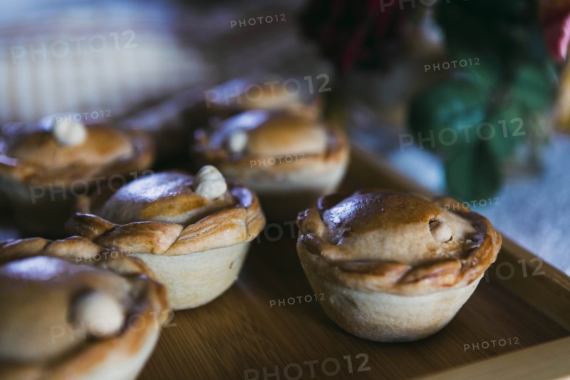 Chicken pies on wooden tray
