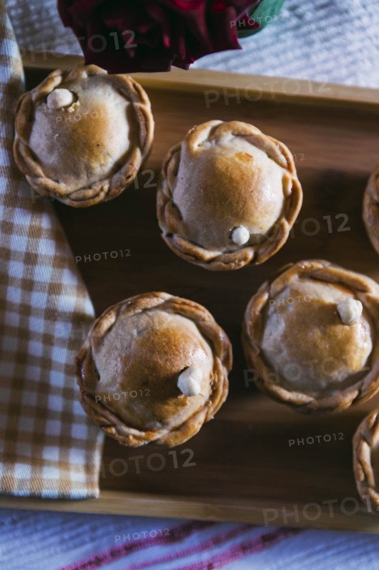 Chicken pies on wooden tray