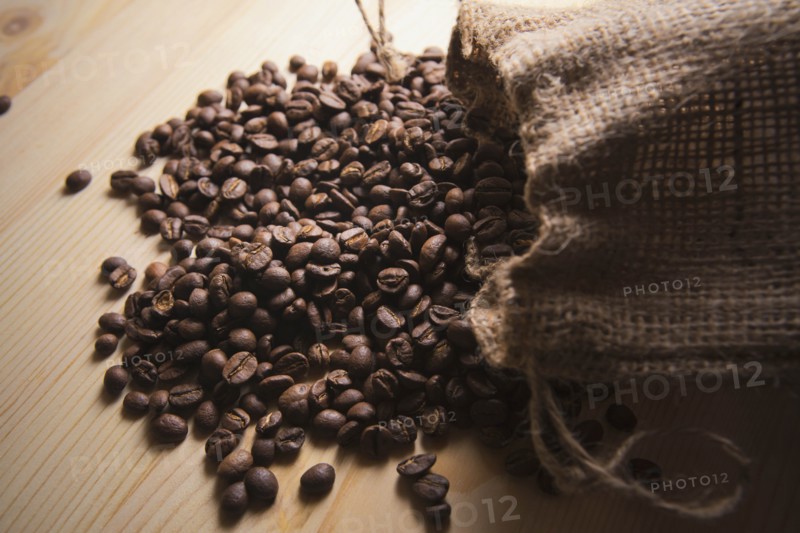 Spilled sack of roasted coffee beans