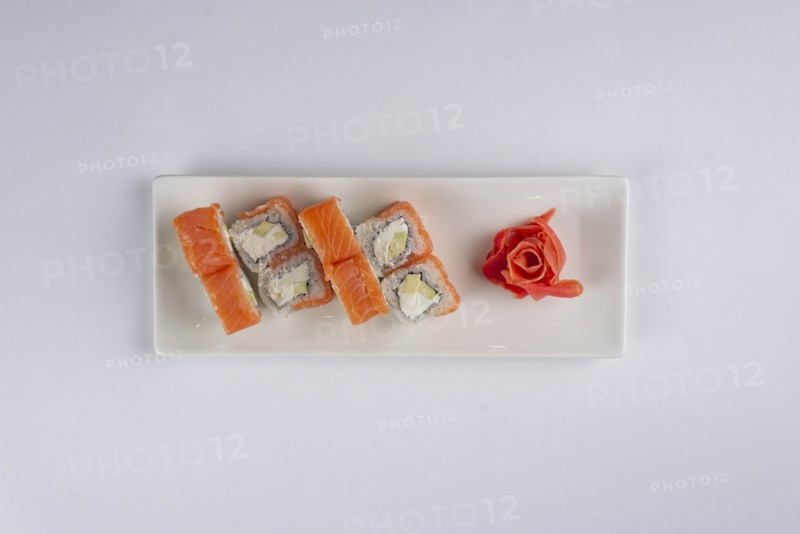 Plate of salmon sushi with pickled ginger