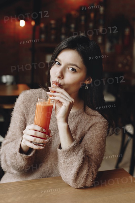 Young woman drinking juice